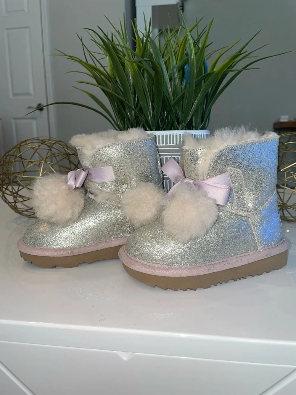 UGG Kids Glitter Boot with Pink Trim and Pom-Poms